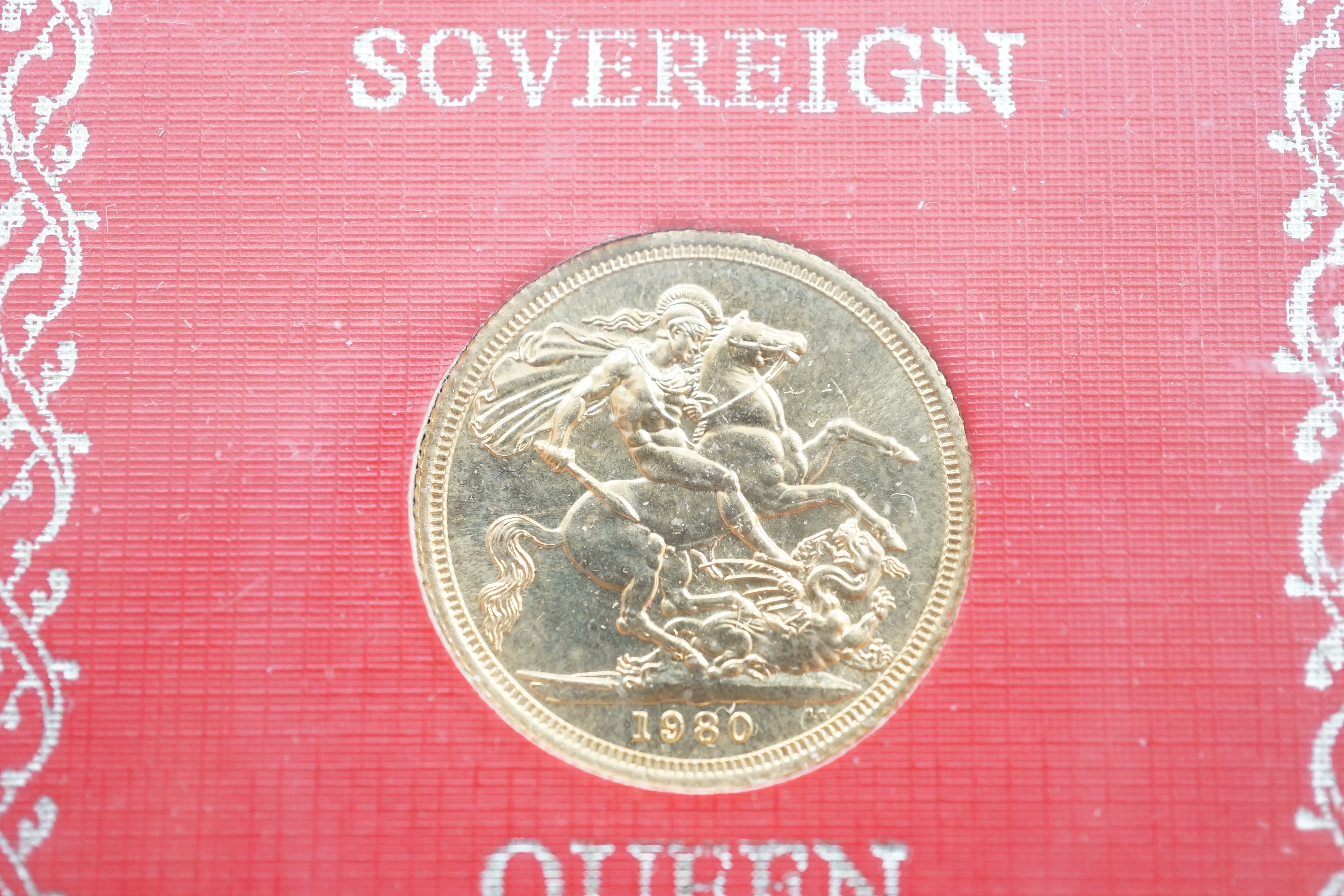 British gold coins, Elizabeth II, 1980 gold sovereign in case of issue, BUNC and a 1982 gold proof half sovereign, in case of issue with certificate